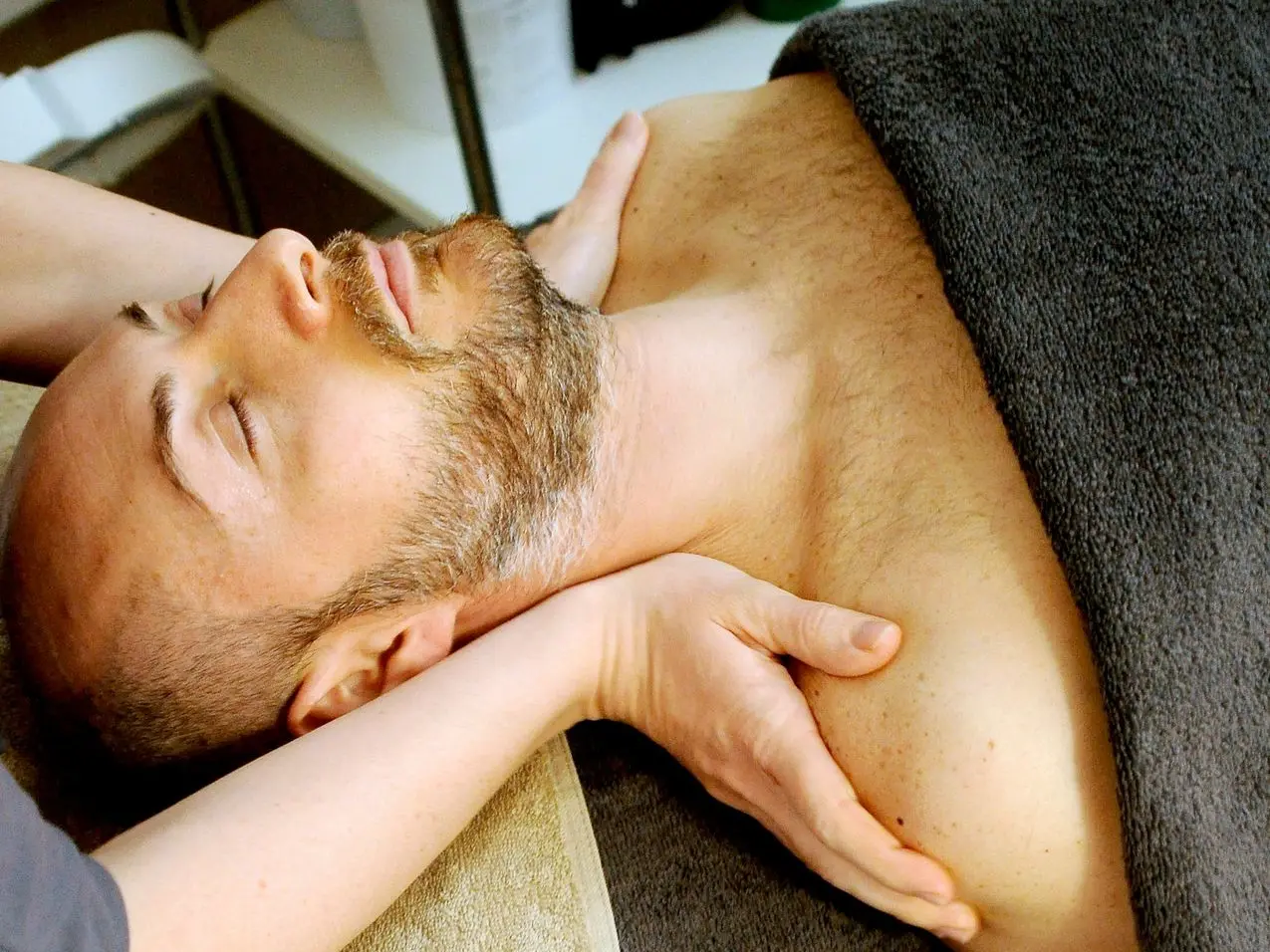 man lying on bed